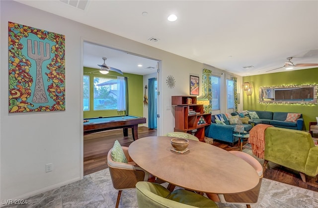 dining space with ceiling fan, hardwood / wood-style floors, and billiards