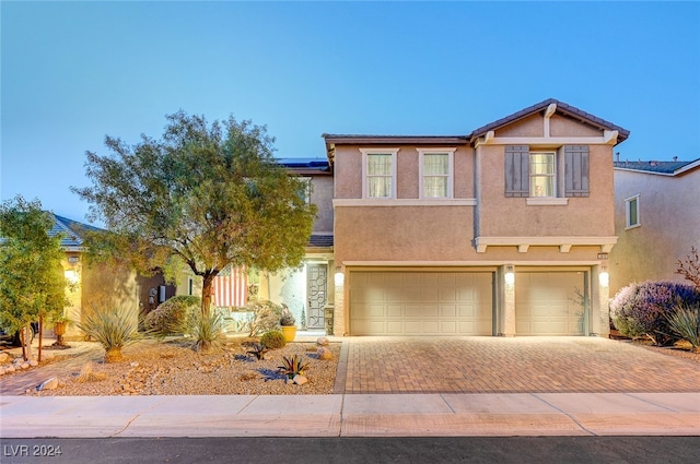 view of front of property with a garage