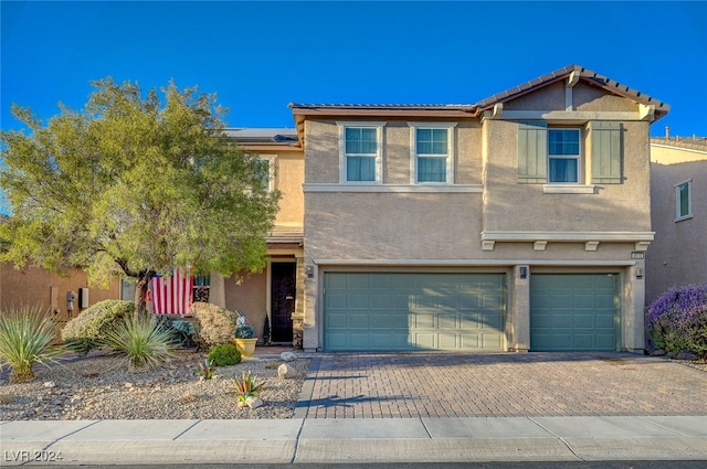 view of front of property featuring a garage