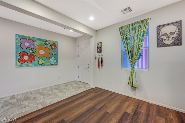 empty room featuring dark hardwood / wood-style floors