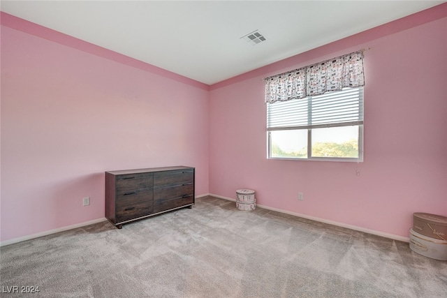 empty room with light colored carpet