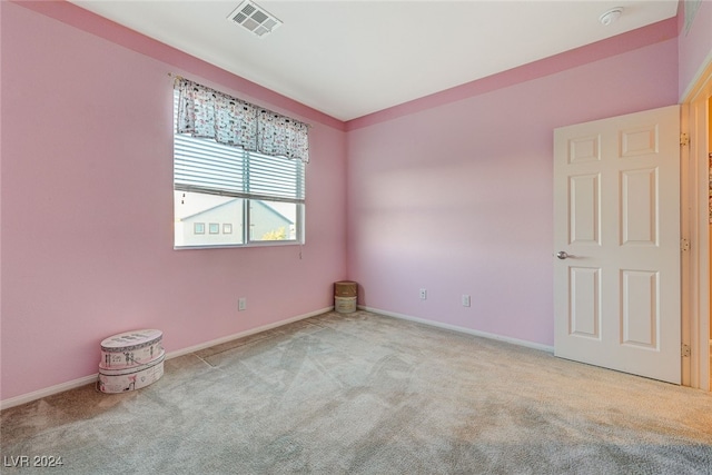 empty room featuring light colored carpet