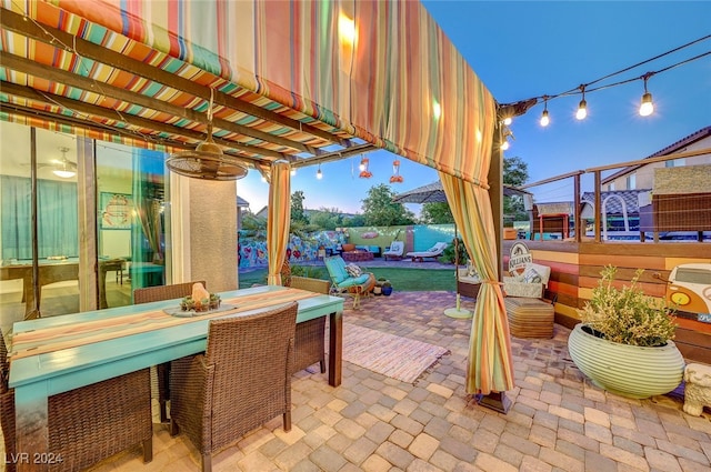 view of patio terrace at dusk