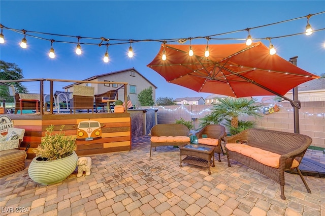 patio terrace at dusk with outdoor lounge area