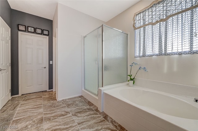 bathroom featuring plus walk in shower