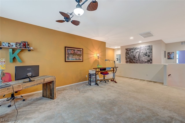 office space with carpet and ceiling fan