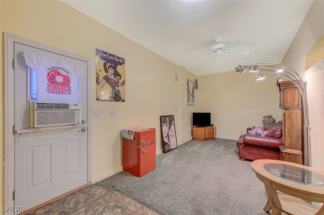 carpeted living room featuring ceiling fan and cooling unit