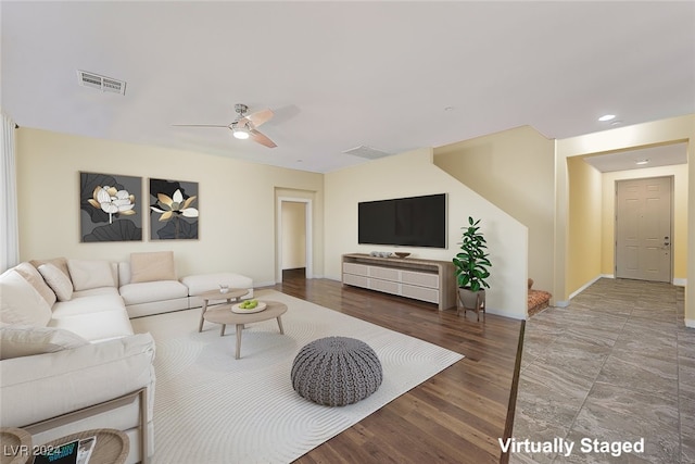 living room with ceiling fan and hardwood / wood-style flooring