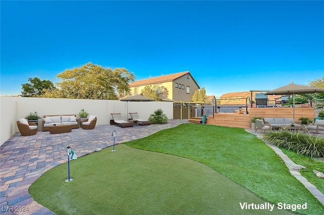 view of yard with an outdoor hangout area and a patio