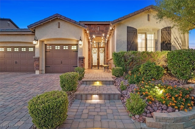 mediterranean / spanish-style house with a garage