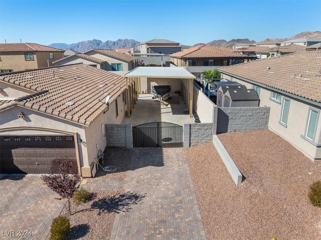 birds eye view of property with a mountain view