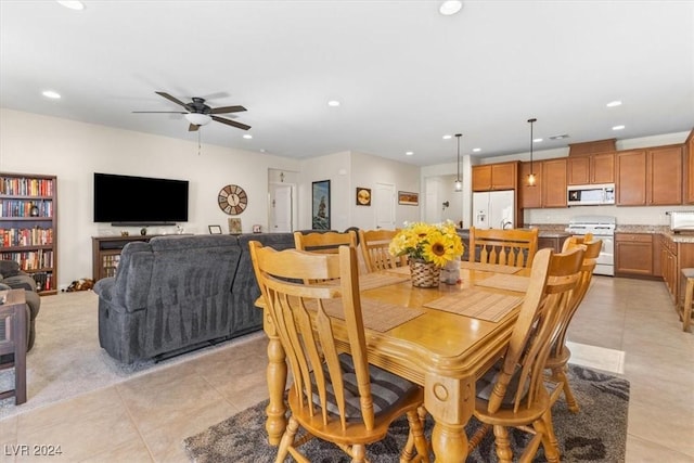 dining room featuring ceiling fan and light tile patterned floors