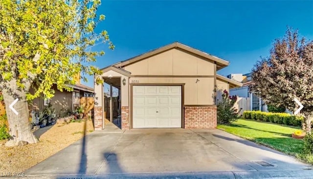 view of front of home with a carport, a garage, and a front lawn