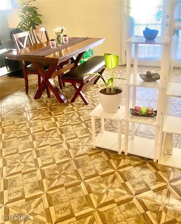 dining space with parquet floors