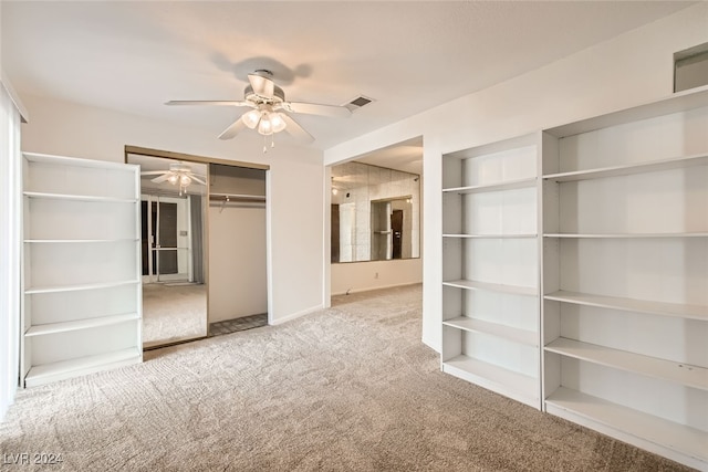 unfurnished bedroom with ceiling fan, a closet, and carpet floors