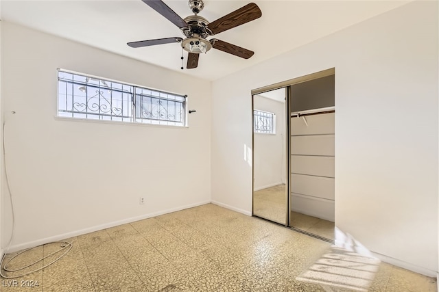 unfurnished bedroom with a closet and ceiling fan