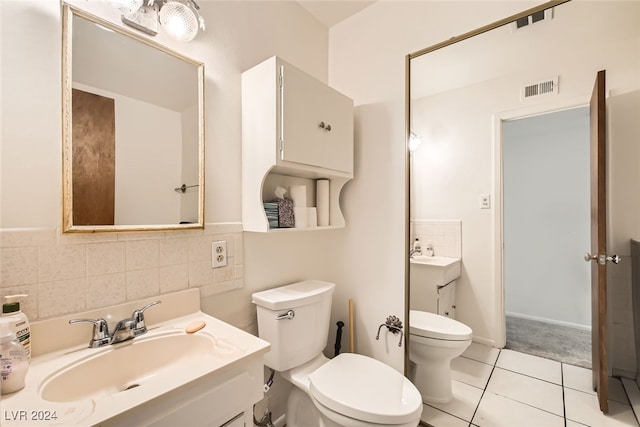 bathroom with tile patterned floors, vanity, toilet, and backsplash