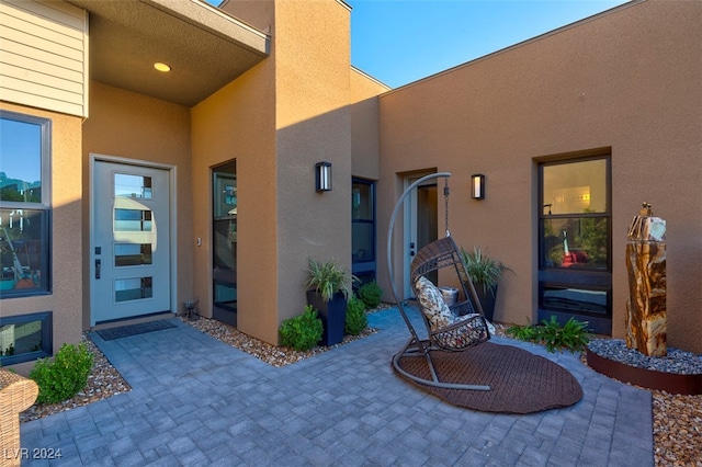 doorway to property with a patio