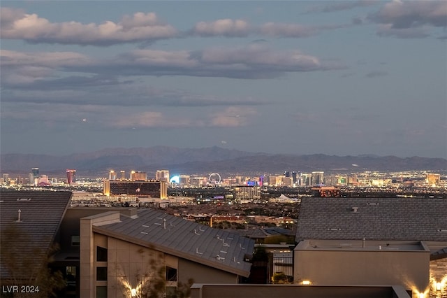 property's view of city featuring a mountain view