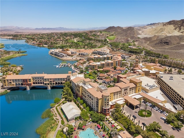 aerial view featuring a water and mountain view