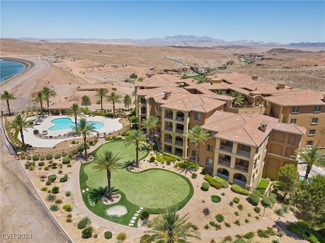 birds eye view of property featuring a mountain view