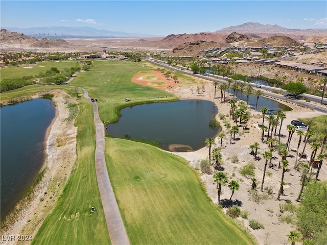 drone / aerial view featuring a water and mountain view