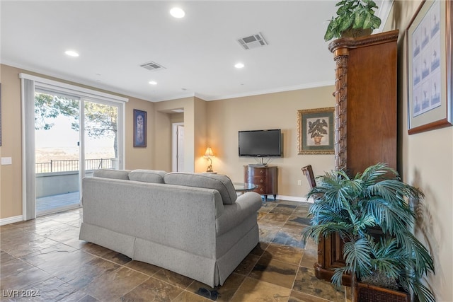 living room featuring crown molding