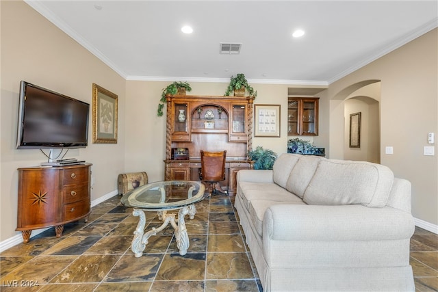 living room featuring crown molding