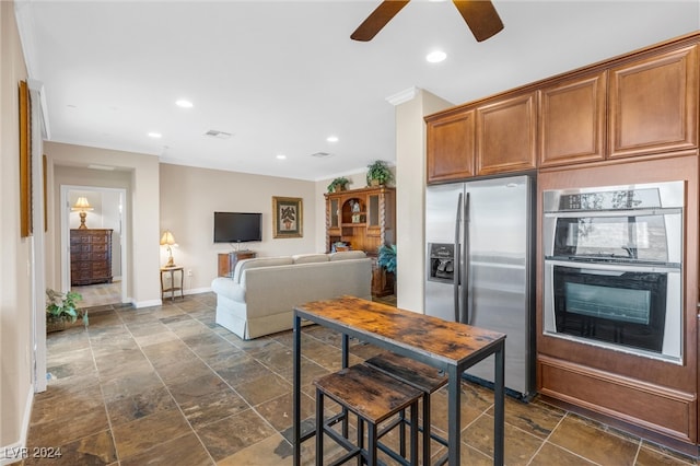 kitchen featuring stainless steel appliances and ceiling fan