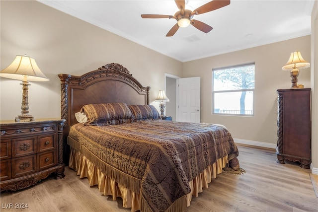 bedroom with ornamental molding, light hardwood / wood-style flooring, and ceiling fan