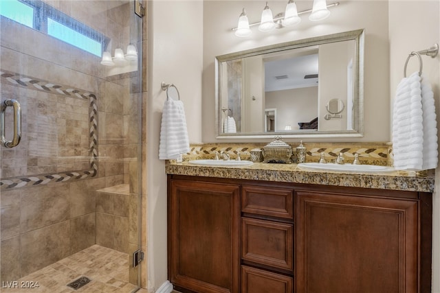 bathroom with walk in shower and vanity