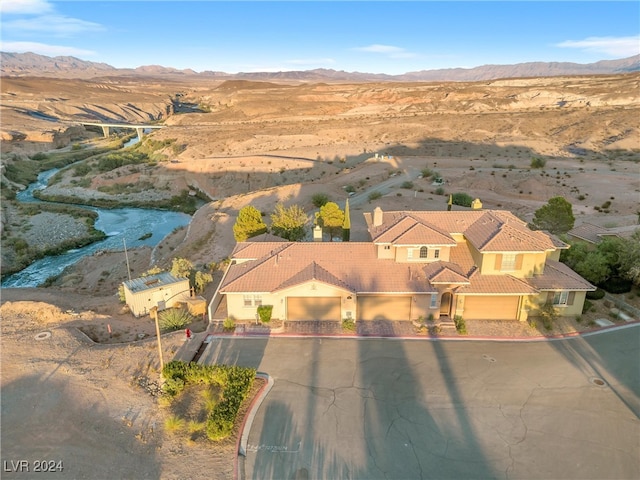 drone / aerial view featuring a mountain view