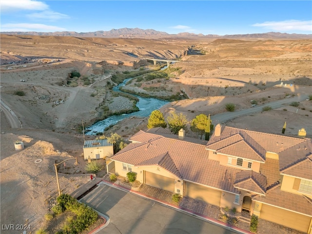 birds eye view of property featuring a mountain view