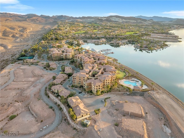 drone / aerial view with a water and mountain view