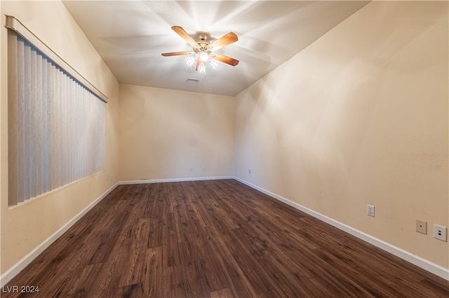 unfurnished room with ceiling fan and dark hardwood / wood-style flooring