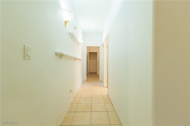 corridor with light tile patterned floors