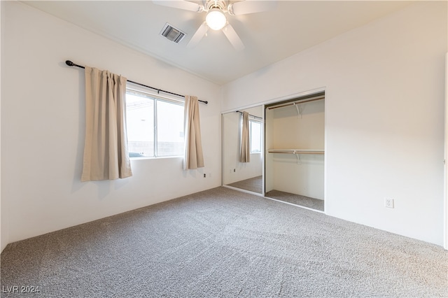 unfurnished bedroom with carpet floors, a closet, and ceiling fan