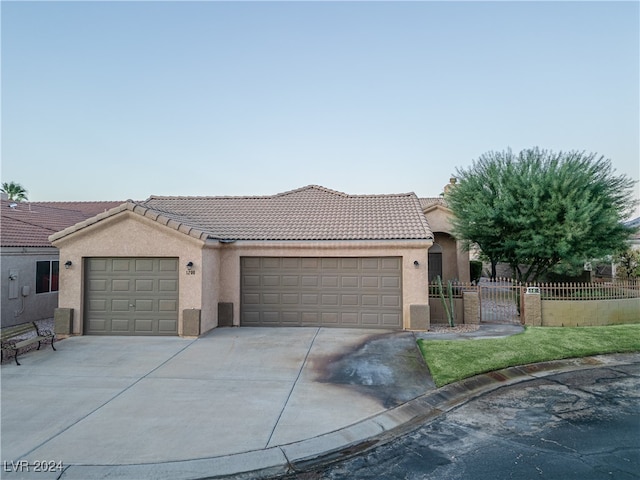 view of front facade featuring a front yard and a garage