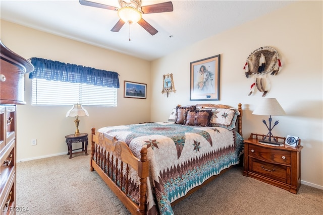 bedroom featuring ceiling fan and light colored carpet