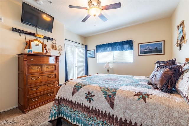 bedroom with light carpet and ceiling fan