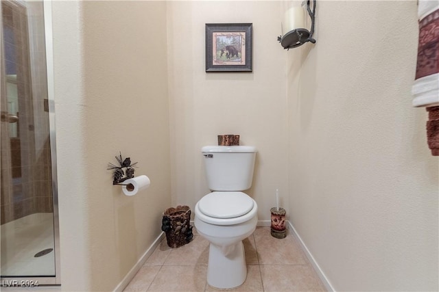 3550 Bay Sands Dr Unit 2082, Laughlin, NV 89029 - bathroom with a stall shower, toilet, tile patterned floors, and baseboards