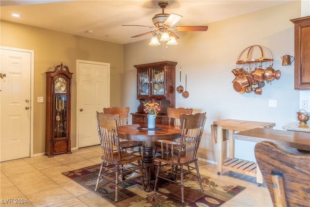 tiled dining area with ceiling fan