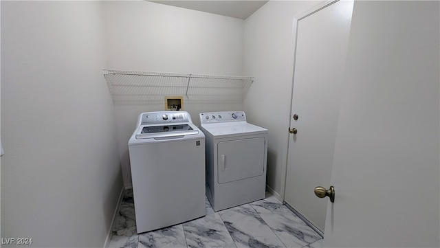 washroom with washer and dryer