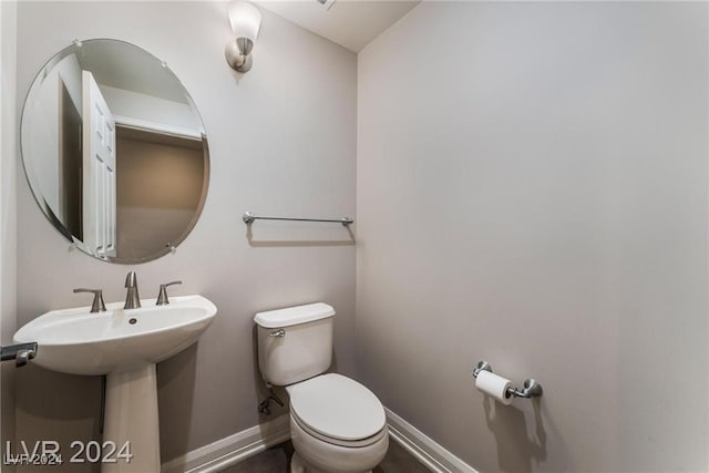 bathroom featuring toilet