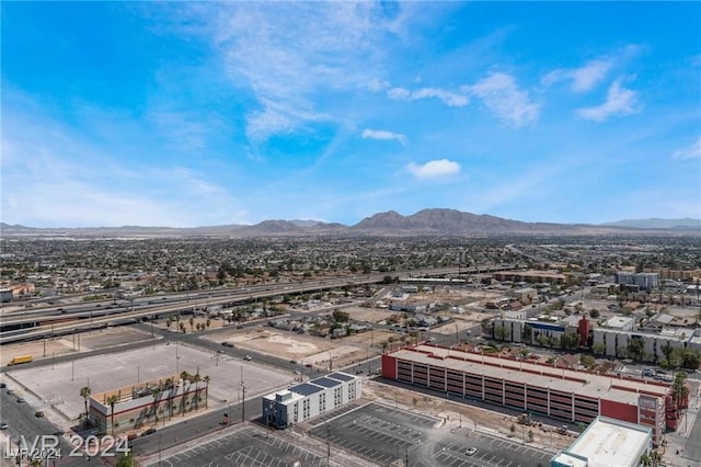 birds eye view of property featuring a mountain view