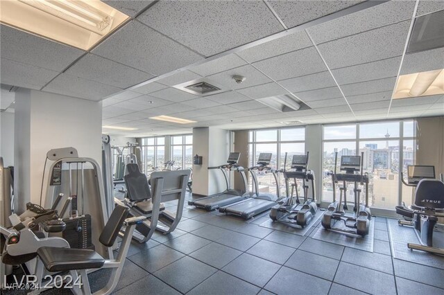 workout area with a paneled ceiling