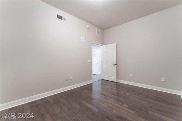 spare room featuring dark hardwood / wood-style floors