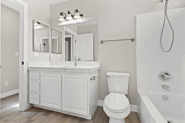 full bathroom featuring toilet, bathtub / shower combination, vanity, and wood-type flooring