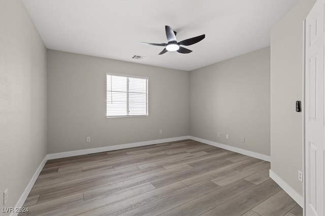 empty room featuring light hardwood / wood-style flooring and ceiling fan