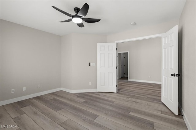 unfurnished bedroom with light wood-type flooring and ceiling fan